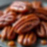 Close-up view of candied pecans glistening with syrup