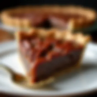 Sliced candied pecan pie revealing its rich filling