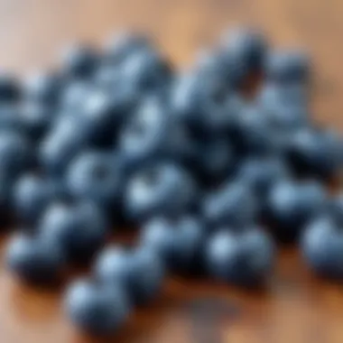 Fresh blueberries scattered on a wooden surface