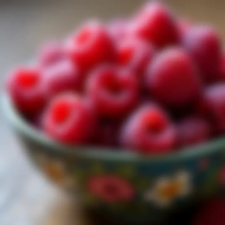 Ripe raspberries in a decorative bowl