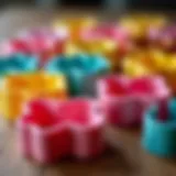 A collection of various cake cutters on a wooden surface