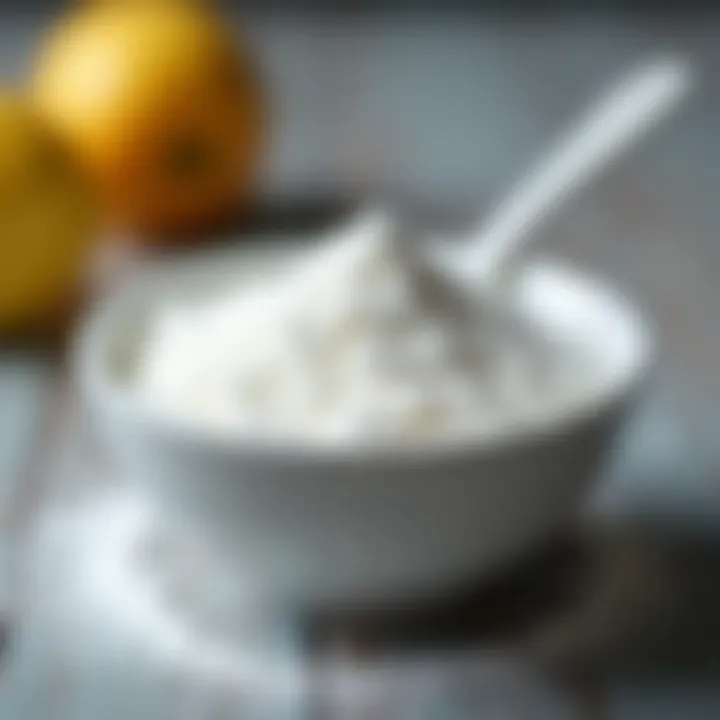 Baking soda powder in a small bowl with a spoon